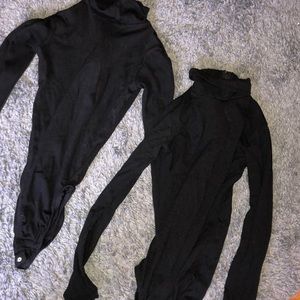 two black body suits.